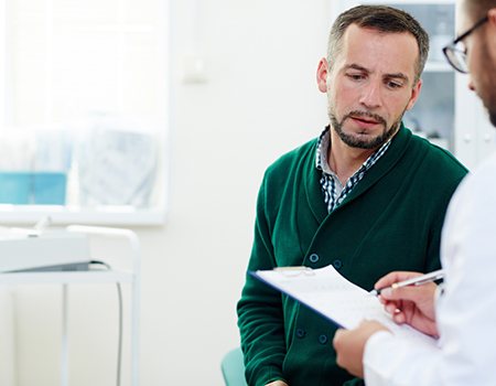 Patient and doctor engaged in serious conversation